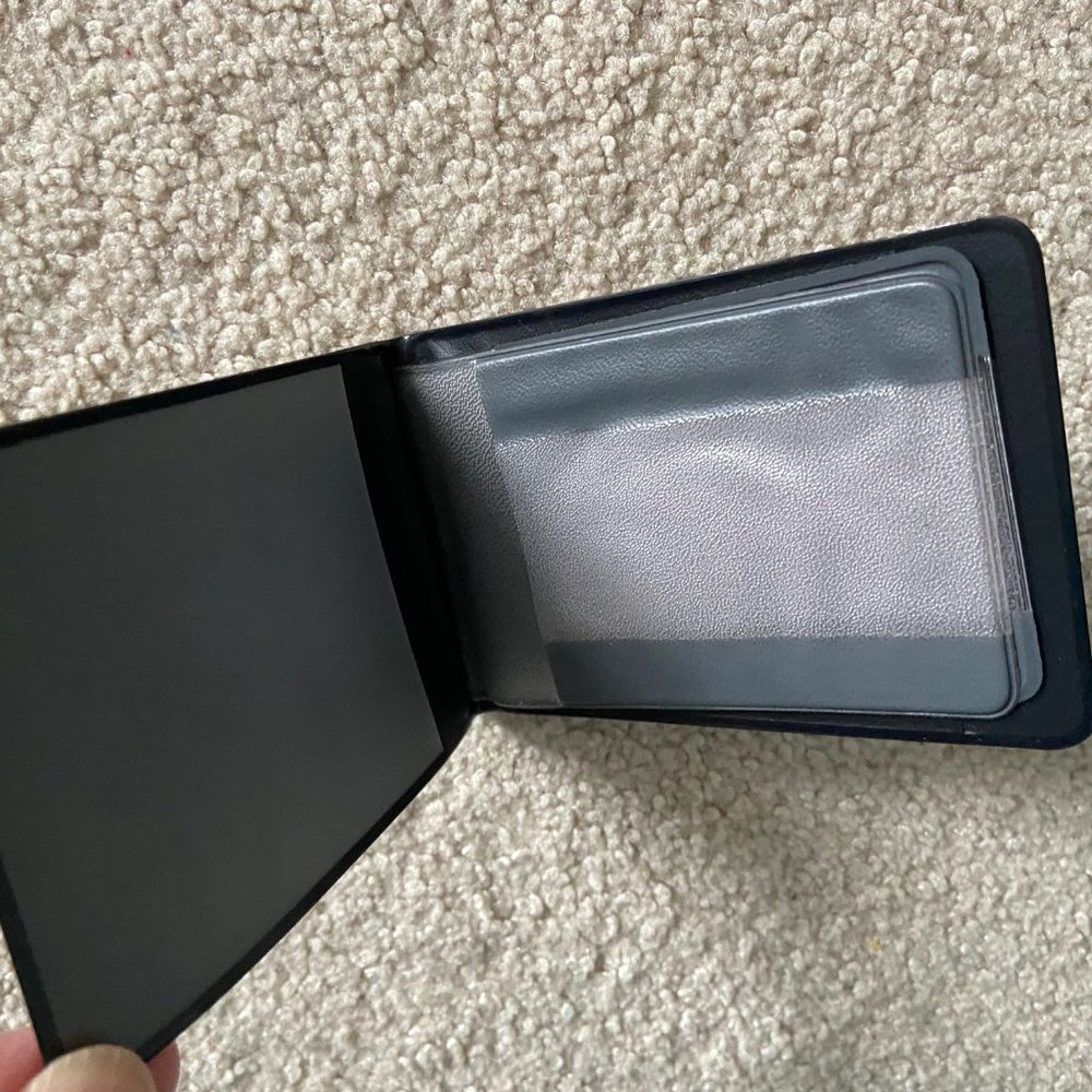 - 5 Bank ID Card holding pockets in one compact waterproof wallet